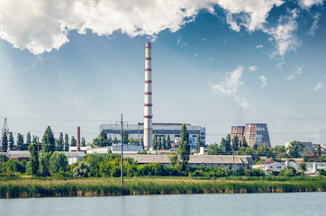 Fototapeta na wymiar Thermal power plant with chimneys, industrial landscape