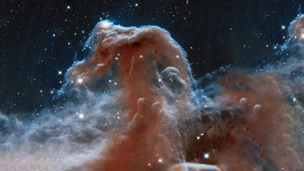 The Horsehead Nebula upper ridge illuminated by Sigma Orionis. Science astronomy concept wallpaper. Elements of this image were furnished by NASA, ESA