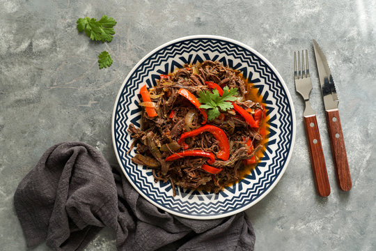 Latin america food .Ropa Vieja with Fried Plantains and rice. carne desmechada, carne desmenuzada, carne mechada  tipical food of Chile, Colombia, Costa Rica, Cuba, Spain, Honduras, Mexico