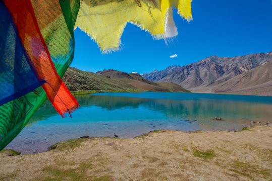 landscape with mountains lake and prayer flag