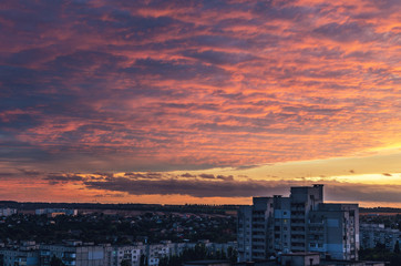 Fototapeta premium Beautiful red fiery sunset over the city, cityscape