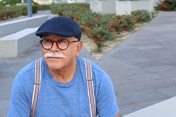 Stylish senior Hispanic man outdoors