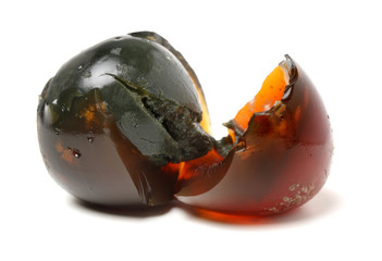 preserved duck eggs on white background