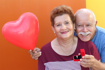 Senior Hispanic man proposing his girlfriend