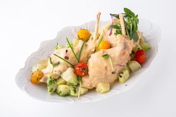 Baked rabbit with vegetables and vegetables in a creamy sauce. Banquet festive dishes. Fine dining restaurant menu. White background.