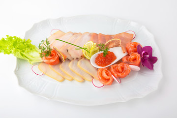 A dish of delicacy salted fish and caviar. Banquet festive dishes. Gourmet restaurant menu. White background.