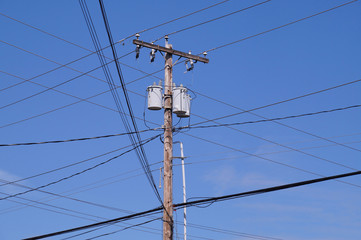 Electrical installation in the USA. Oil transformers on a wooden pole. If mounted on a utility...