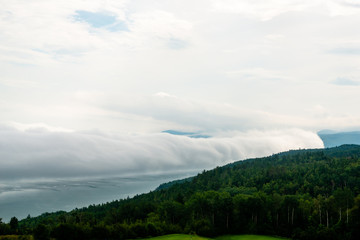 Fototapeta premium Foggy day by the St-Laurent river, golf field 