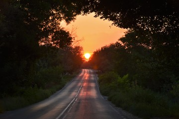 sunrise at the end of the road
