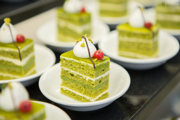 Selective focus of Green tea cake on  the buffet counter
