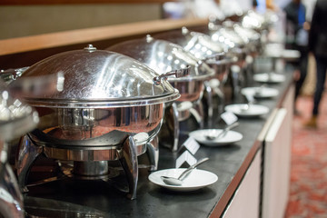 Chafing dishes on the table at the  luxury banquet