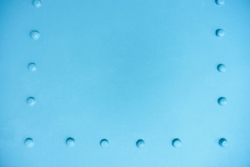 new painted blue matt metal rivets on iron sheet, abstract pattern background, stock photo image with copy space for text