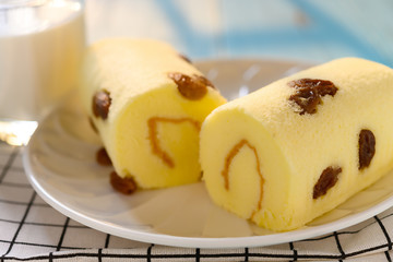 cakes with raisin and cup of milk in a sunny morning
