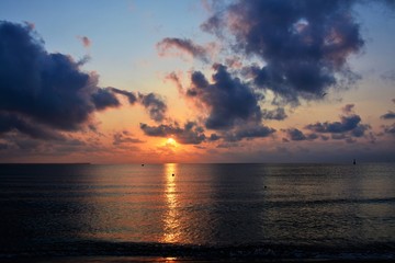 sunrise with clouds on the seashore