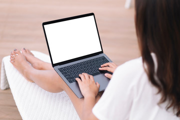 Mockup image a woman using and typing on laptop computer while sitting at terrece