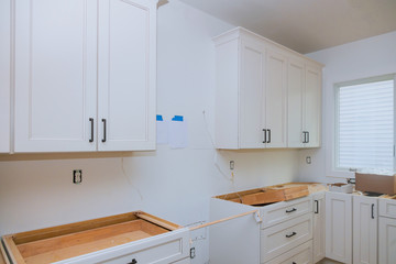 White of kitchen wooden cabinets with contemporary