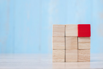 Red wooden block on the building. Business planning, Risk Management, Solution, strategy, different and Unique Concepts