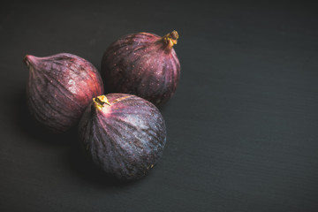 Fresh ripe figs on the rustic background. Selective focus. Shallow depth of field.