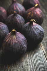Fresh ripe figs on the rustic background. Selective focus. Shallow depth of field.