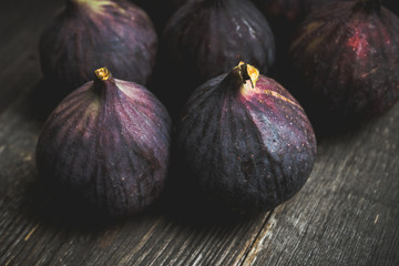 Fresh ripe figs on the rustic background. Selective focus. Shallow depth of field.