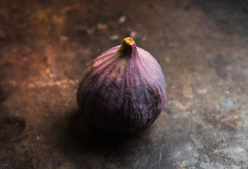 Fresh ripe figs on the rustic background. Selective focus. Shallow depth of field.