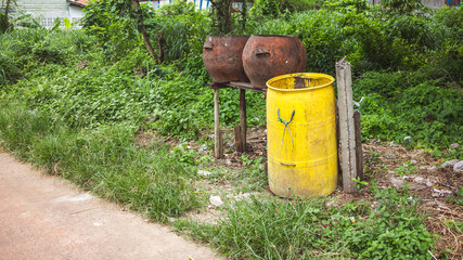 Old trash cans along the way with nature