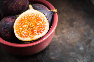 Fresh ripe figs on the rustic background. Selective focus. Shallow depth of field.