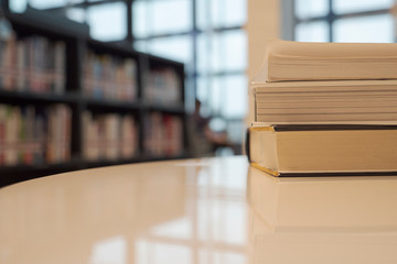 selective focus book on working table at library , education concept.