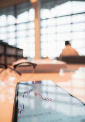 candle stick bar chart forex trading at working table with copyspace , business concept.