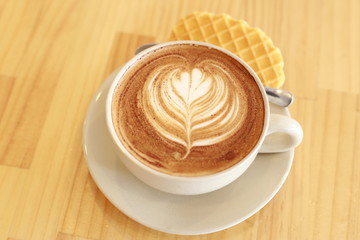cup of coffee with cream on white background with copy space for text