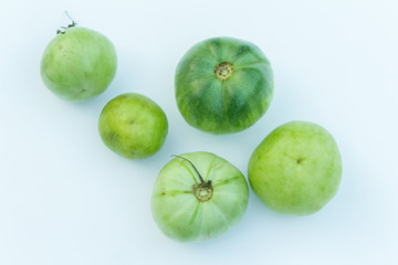 fresh and green tomatoes on white background