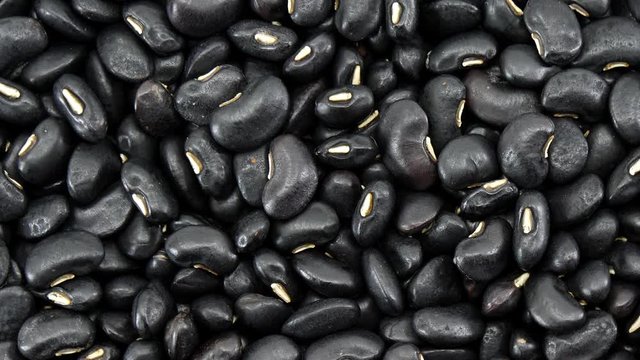 Raw Black beans seed food organic top view texture ,Rich in calcium, which helps maintain bones and teeth, supplementary food, Protein healthy food, video footage.