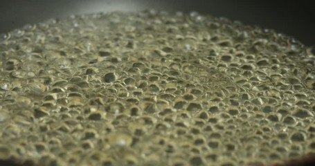 Water boiling,Close-up in pot of boiling water,Bubbles of boiling water	