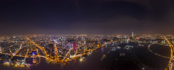 Ultra high resolution aerial panorama of Ho Chi Minh City or Saigon Vietnam under lights at night...