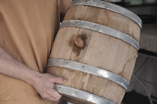 New oak barrel with young wine, transported to storage.