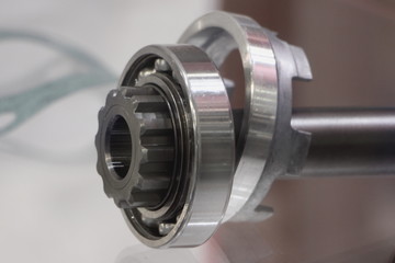 New shiny ball bearing on half axle shaft close up