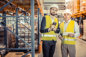 Handsome young man wearing helmet during work