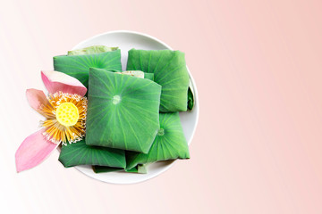 Rice wrapped in fresh lotus leaf.eco packaging style. 