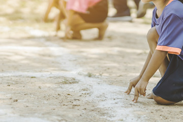 Students fitness training for sprinting on an athletic track in school.
