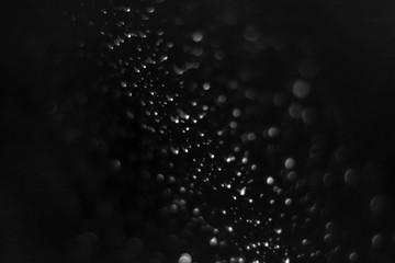 Drops on the glass in the dark. Close up