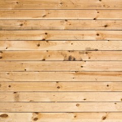 Obraz premium Texture of fresh wooden fence. New, light wooden boards. Close up