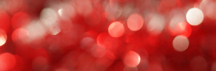 blur glitter, bokeh, defocused red festive background,  texture. Xmas abstract background .