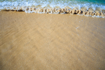 beautiful sandy beach and soft blue ocean wave