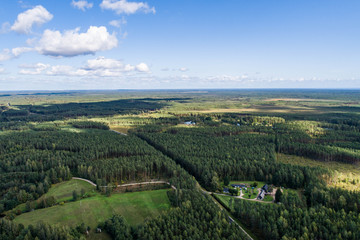 Overhead view of foliage trees, fields and roads in Western Europe. Aerial photography.