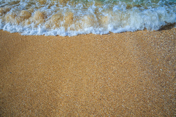 beautiful sandy beach and soft blue ocean wave