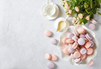 french pink and lavender macarons on a cake stand