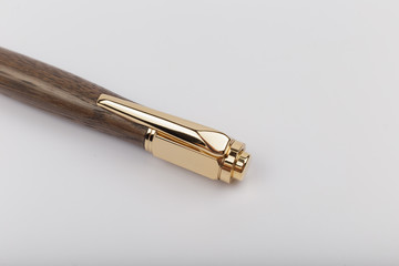 Exotic, Luxury Iroko wood bolt-action pen with chrome metal fixtures and beautiful knot in the wood - Product Photo Ballpoint Pen Handmade Hand Crafted.