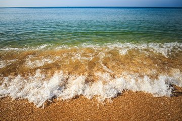 beautiful sandy beach and soft blue ocean wave