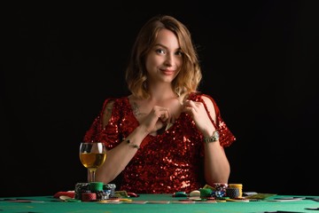 Poker girl wins a jackpot in a casino. On a black background. Winning in a casino.