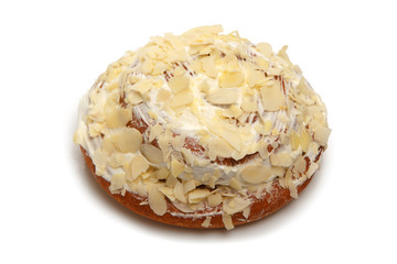 Delicious glazed bun with almond petals
